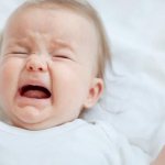 baby cries before peeing