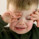 Child crying due to eye pain